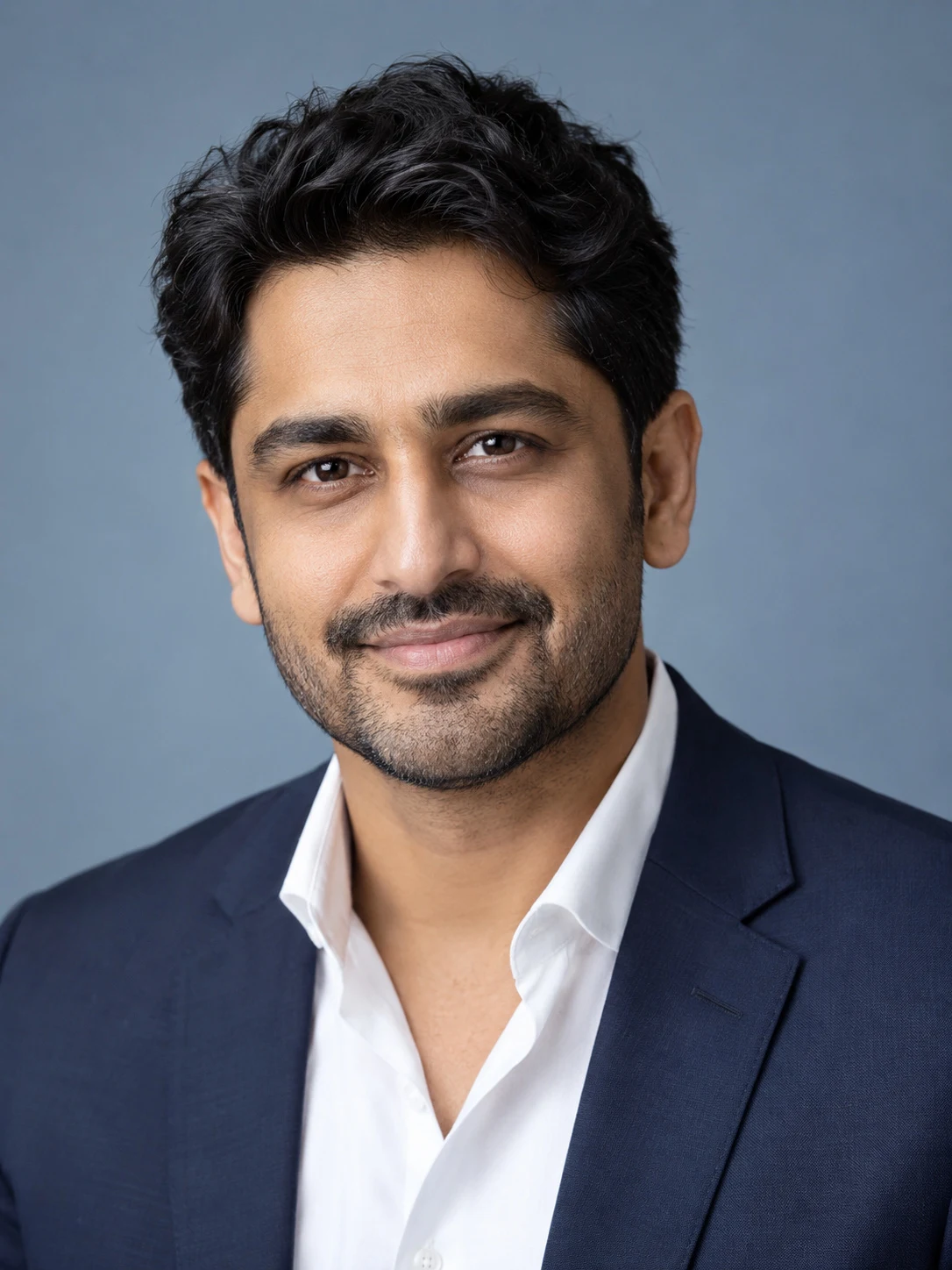 Professional headshot concept of an adult man in a navy jacket