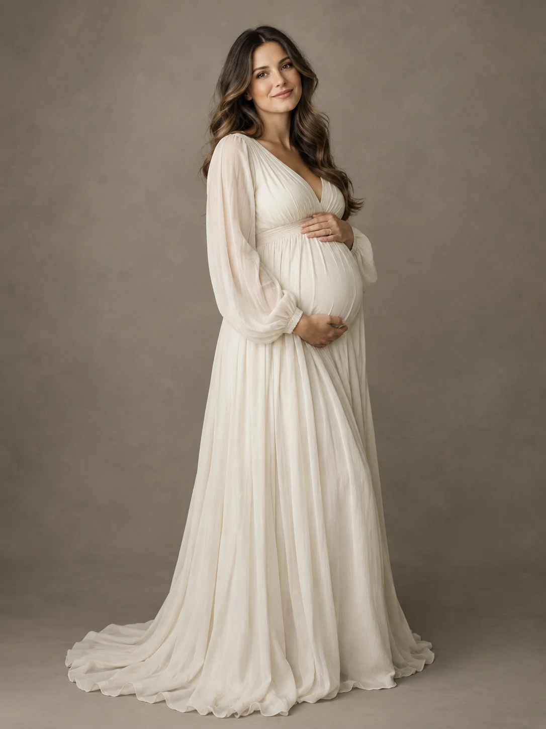 Maternity concept portrait in a flowing ivory dress